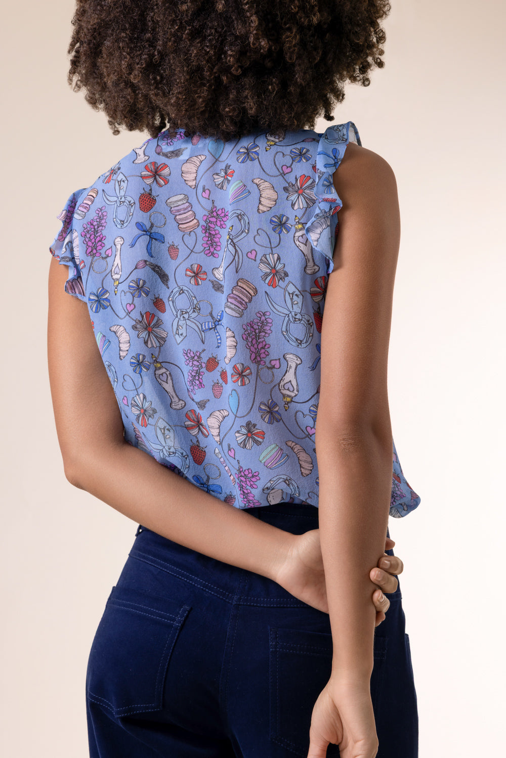 Perfume Print Sleeveless Blouse