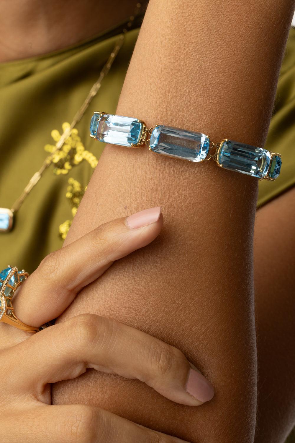 Blue Topaz Single Line Gossip Bracelet-YELLOW GOLD-6.5-JEWELRYFINE JEWELBRACELET O-GOSHWARA