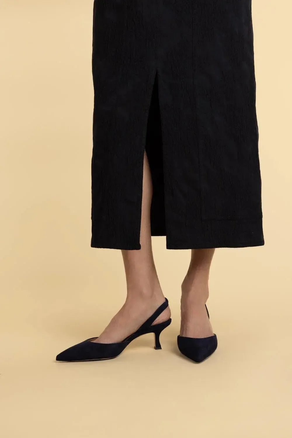 a person wearing black shoes