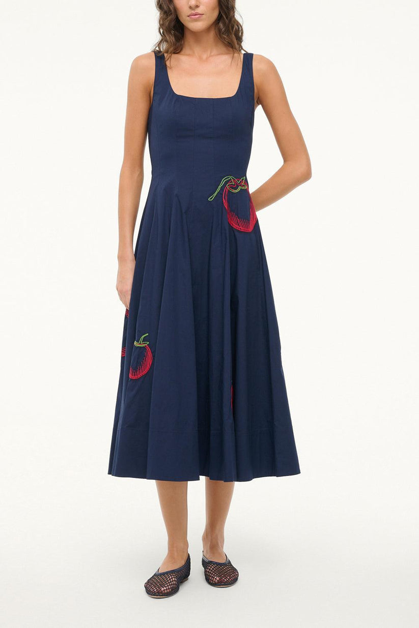 a woman in a blue dress