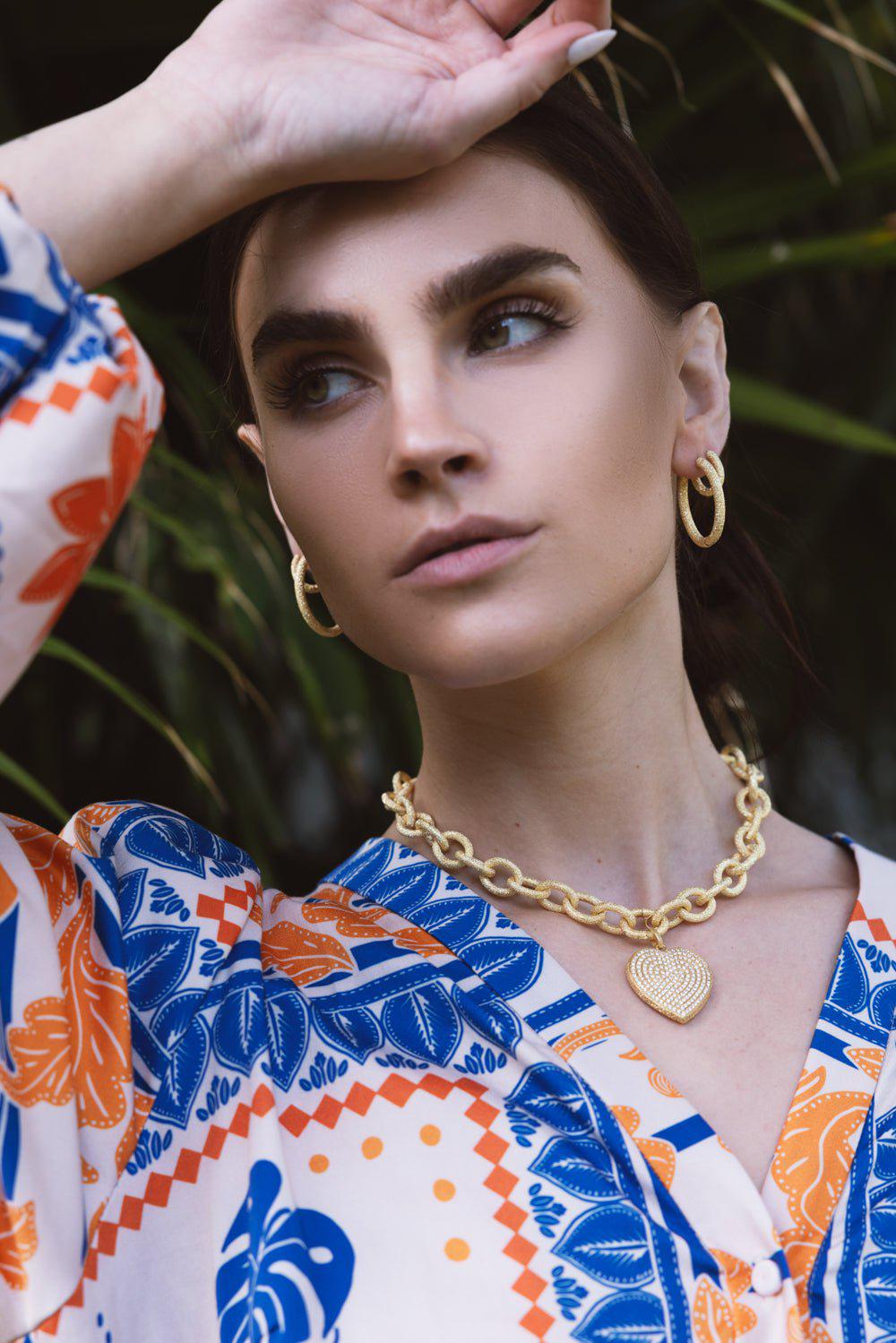 Florentine Finish Large Oval Hoop Earrings | CAROLINA BUCCI