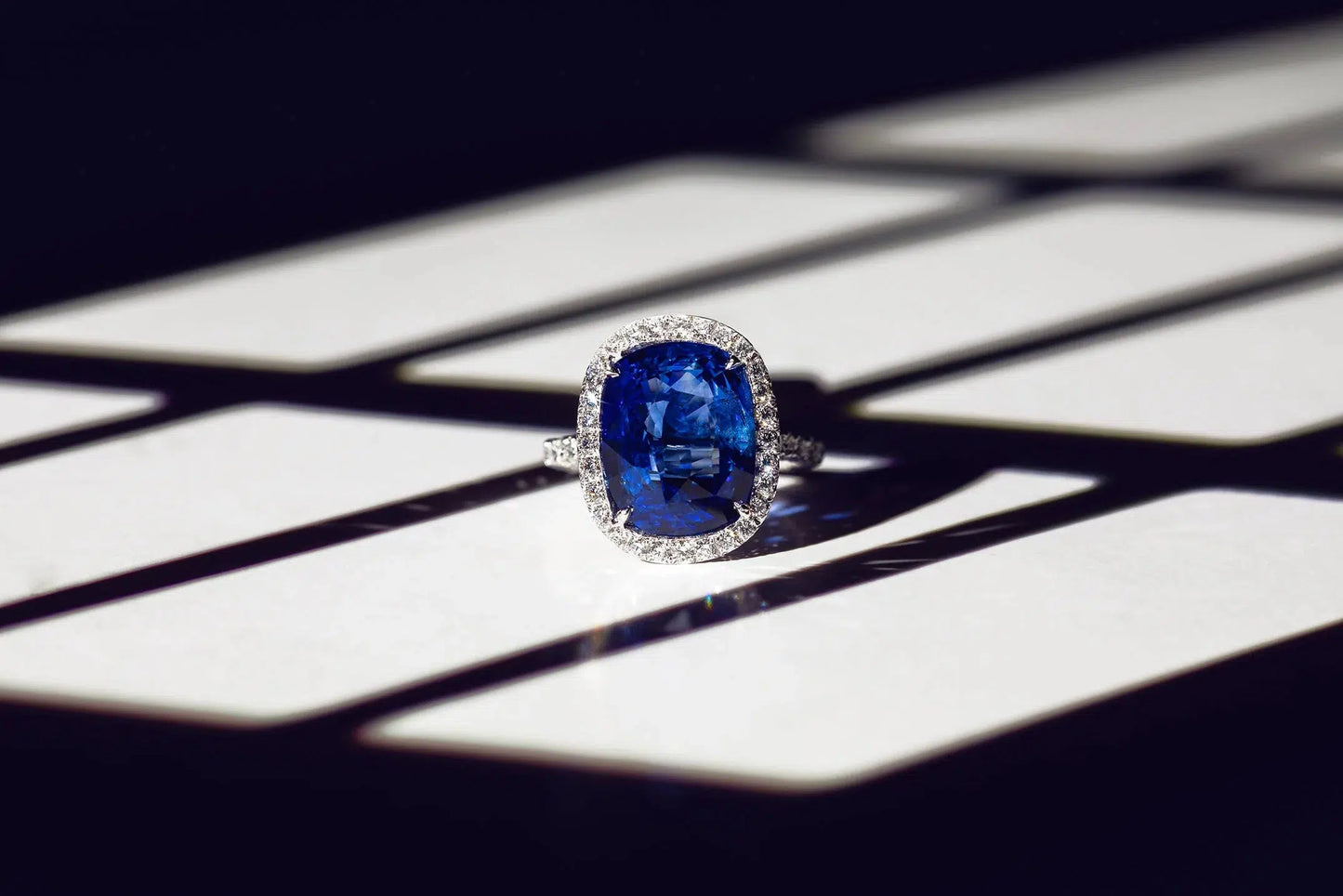 DIANA M. JEWELS-Sapphire Diamond Halo Ring-PLATINUM